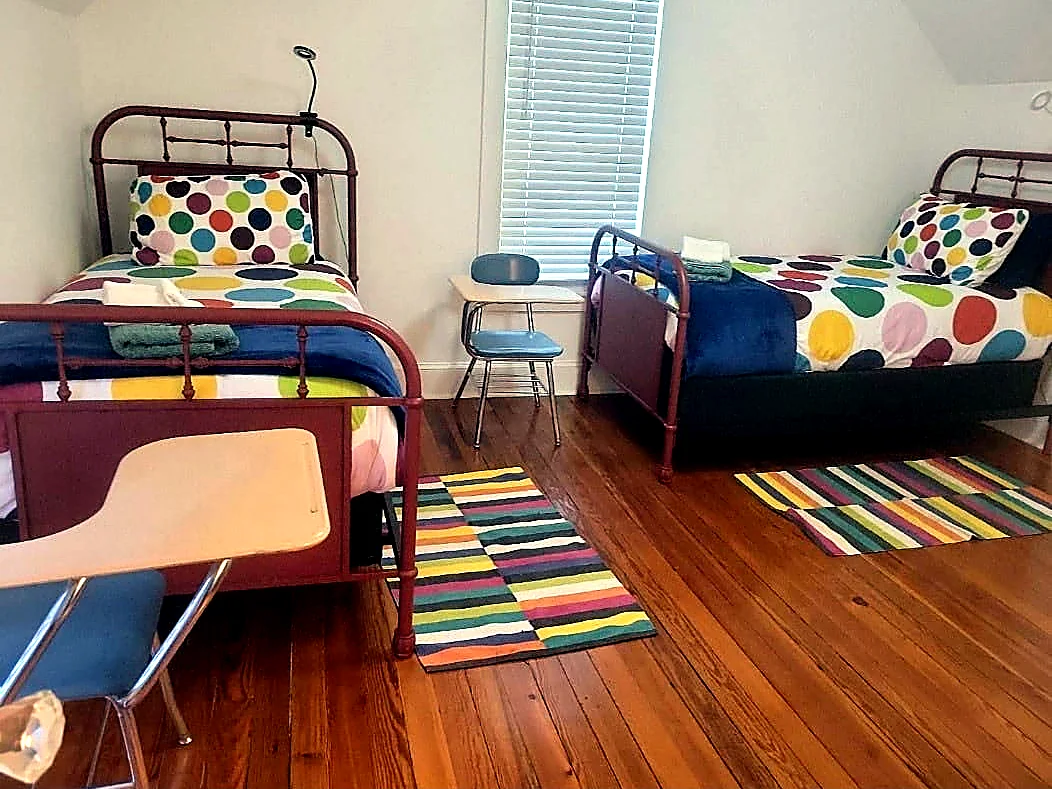 Clean bedroom with two beds